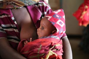 A mother breastfeeds her four-month-old son..jpg